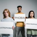Photo by MART PRODUCTION: https://www.pexels.com/photo/people-holding-signs-of-different-forms-of-phobia-8459033/
