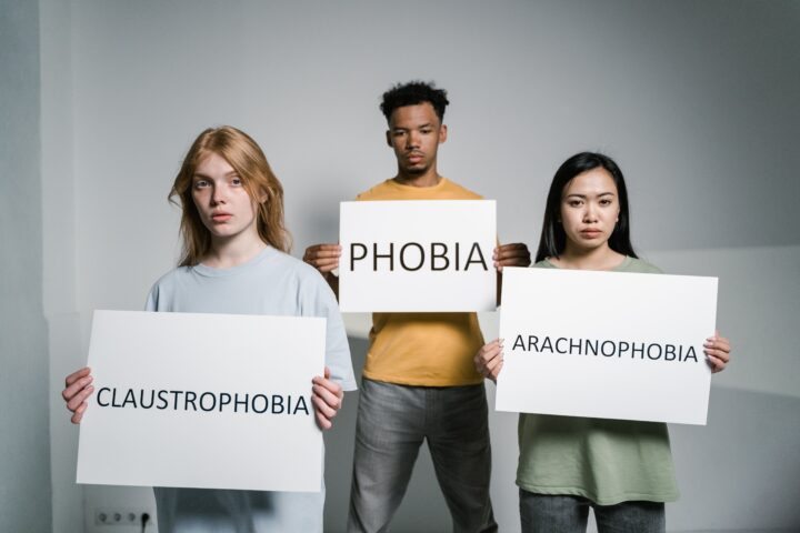 Photo by MART PRODUCTION: https://www.pexels.com/photo/people-holding-signs-of-different-forms-of-phobia-8459033/
